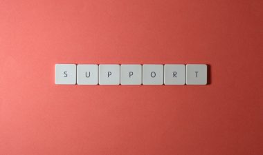 pexels photo 2882672 2882672 Close-up of the word 'support' spelled with keyboard keys on a red background.